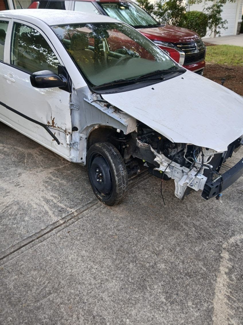 Wrecked white car we bought for cash - any condition