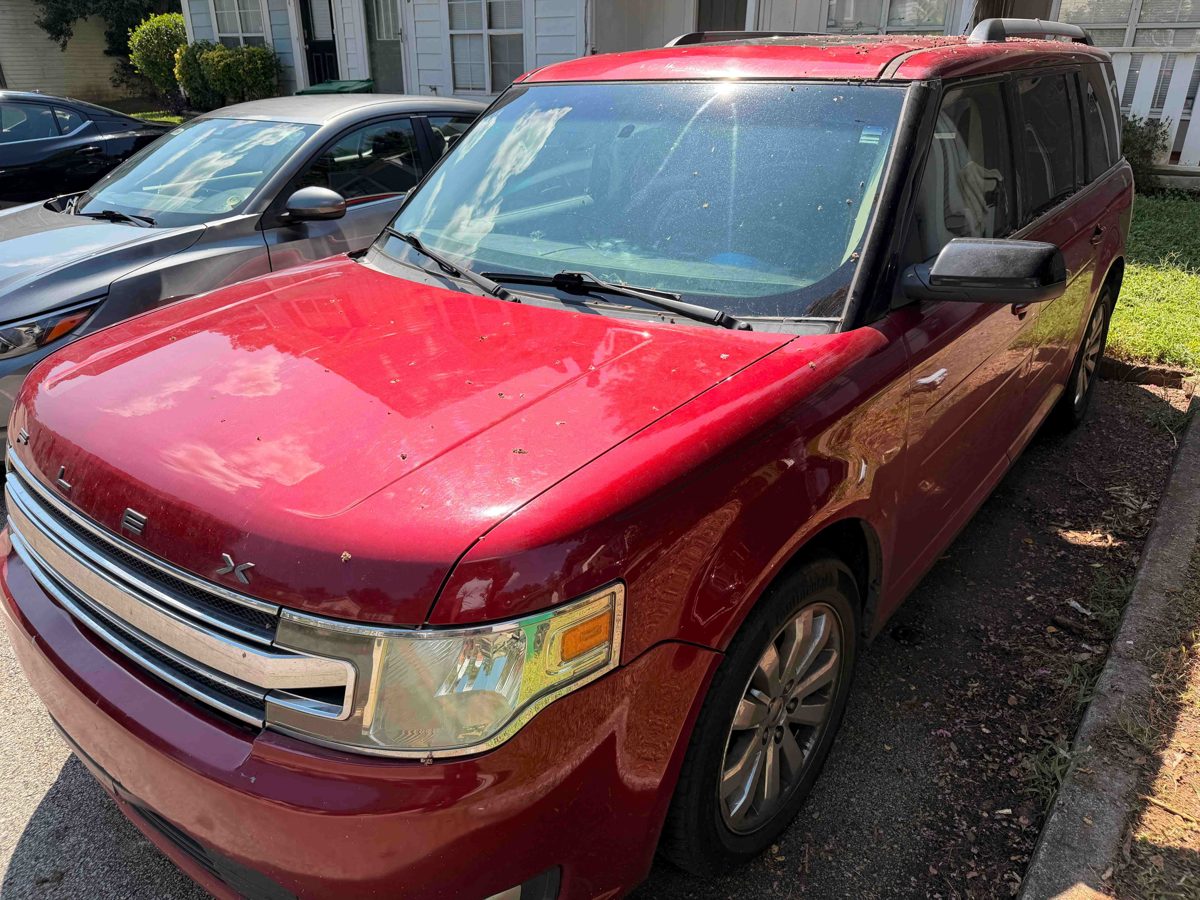 Red Ford Flex SUV we bought for cash