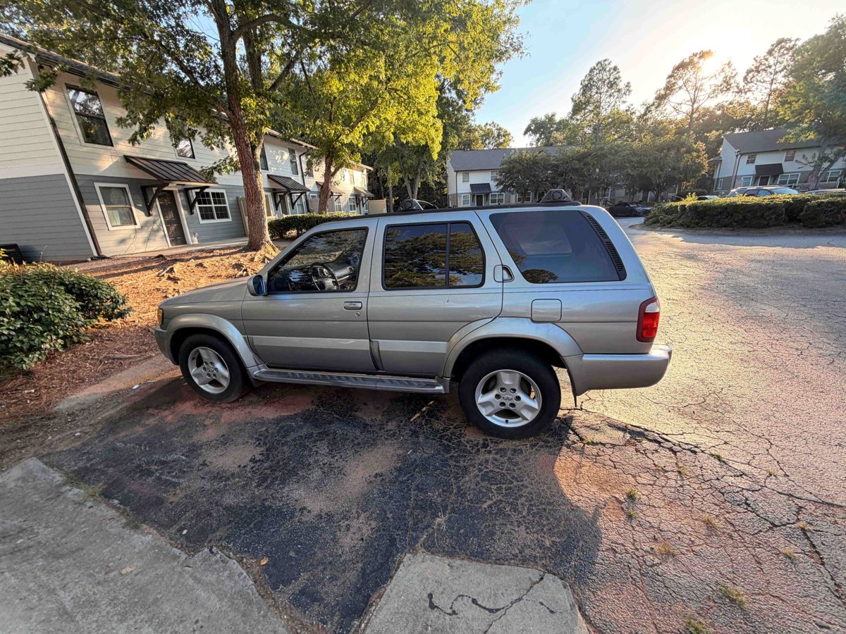 Silver Nissan Pathfinder SUV we bought for cash